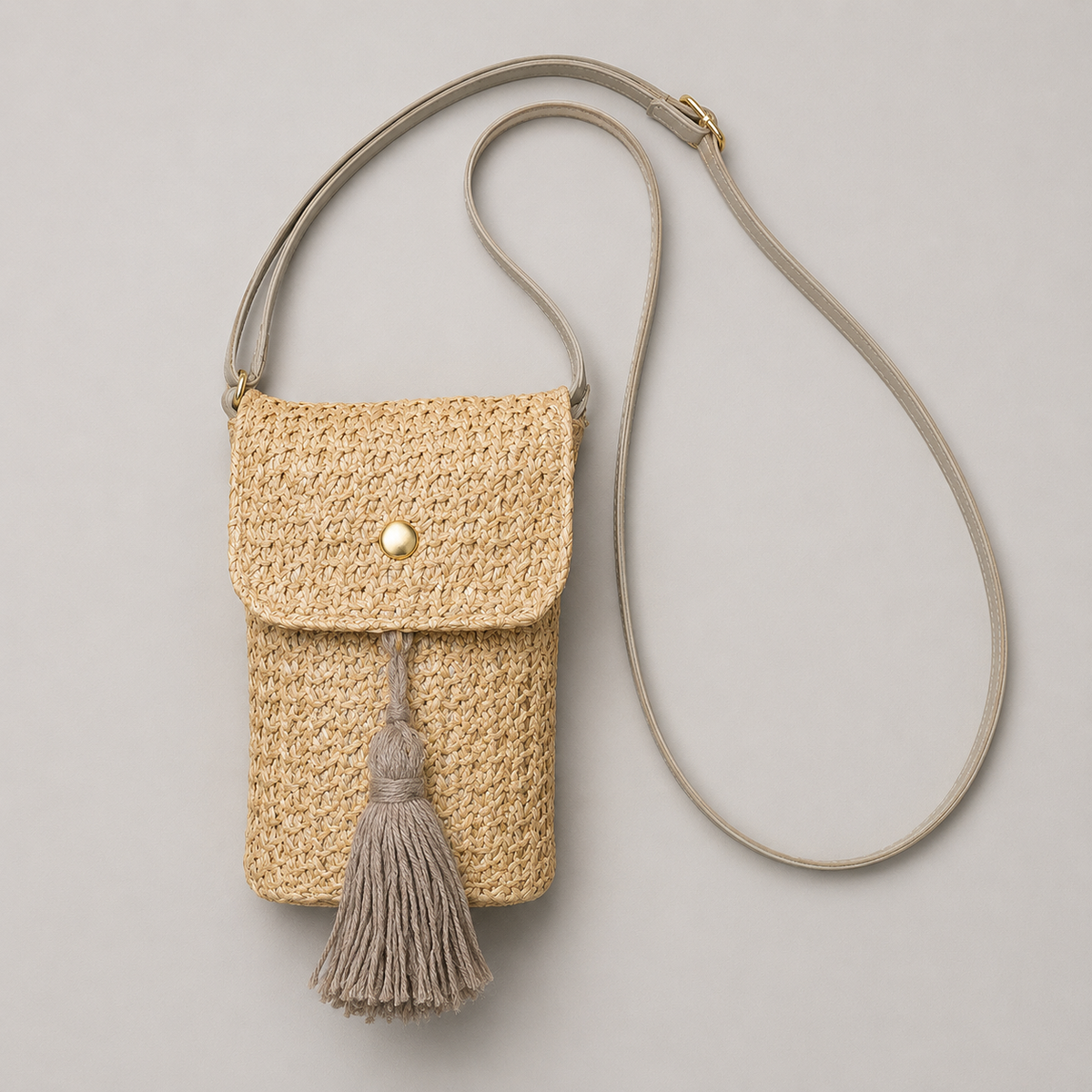 Straw phone crossbody bag flat lay